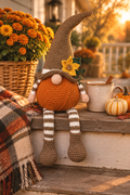 Pumpkin gnome on a cozy fall porch step